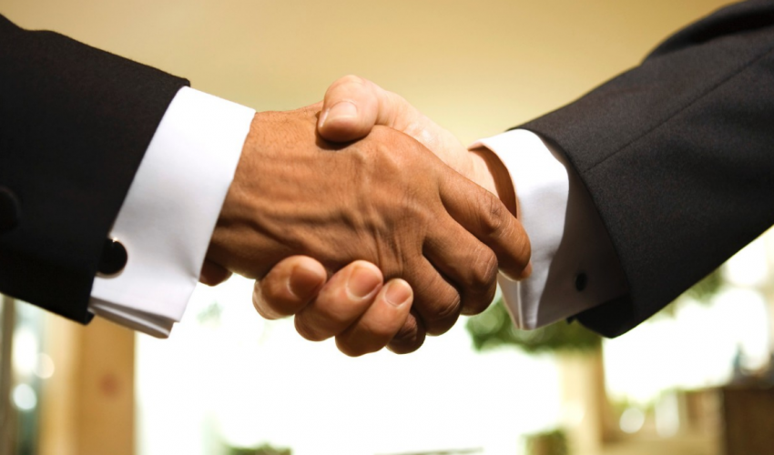 080813-national-us-corporations-shake-hands-with-africa-businessmen-shaking-hands.jpg